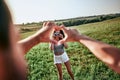 Closeup shot of young man and woman making heart shape with hand Royalty Free Stock Photo