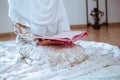 Closeup shot of a young Muslim reading the Koran, the holy Islamic book