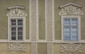 Kutna Hora medieval architecture shows fanciful window trims with dimensional plaster.