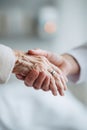 Closeup shows caring hands, young holding elderly. Symbolizes support, compassion, empathy, intergenerational relationships. Royalty Free Stock Photo