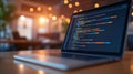 This closeup shows a laptop screen displaying colorful coding scripts in a modern setting, emphasizing technology and Royalty Free Stock Photo
