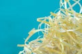 Closeup shredded paper texture and reuse colorful or white yellow paper scrap of document on blue  background. Selective focus ima Royalty Free Stock Photo