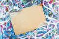 Closeup shredded paper texture and reuse paper scrap of document with brown paper background. Selective focus image