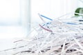 Closeup shredded white paper texture and reuse paper scrap of document with light background. Selective focus image Royalty Free Stock Photo