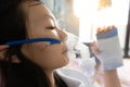 Closeup of sick asian child girl wearing oxygen mask has problems with the respiratory disease,treatment from oxygen therapy,