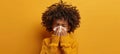 Closeup of sick young boy blowing his nose into a tissue with generous space for text placement Royalty Free Stock Photo