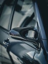 Closeup of a side mirror of a modern gray car Royalty Free Stock Photo