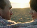 Closeup Side View Of Couple Looking At Each Other At Beach