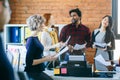 Closeup side view shot of blonde standing with coffee Royalty Free Stock Photo