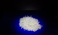 Closeup side view of a white rice at blue background