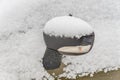 Closeup of sideview mirror covered with snow