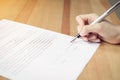 Closeup of signing a documentation agreement and pen on the table Royalty Free Stock Photo