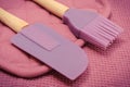 Closeup of silicone kitchen accessories, spatula and brush