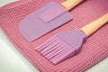 Closeup of silicone kitchen accessories, spatula and brush