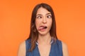 Closeup of silly dumb brunette woman demonstrating tongue and making stupid face with crossed eyes