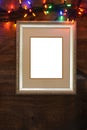 Closeup silver frame with christmas lights Royalty Free Stock Photo