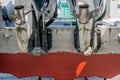 Closeup of silver props on twin outboard boat in dry dock