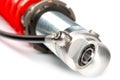Closeup of a silver and red coil shock absorber Royalty Free Stock Photo