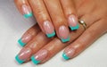 Closeup of simple green french manicure on square-shaped nails