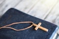 Closeup of simple wooden Christian cross necklace