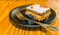 Closeup of single piece of carrot cake decorated with a pecan Royalty Free Stock Photo