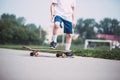 Closeup of skateboarder legs.