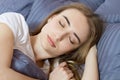 Closeup - Sleep. Young Woman Sleeping In Bed. Portrait Of Beautiful Female Resting On Comfortable Bed With Pillows In Bedding In