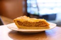 Closeup of a slice of cinnamon apple pie on a plate.