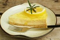 Slice of mouthwatering sweet and tart lemon cream cheese pie on a white plate