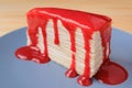 Slice of Mouthwatering Vanilla Mille Crepe Cake with Raspberry Sauce