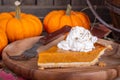 Closeup of a Slice of Pumpkin Pie With Whipped Cream Topping Royalty Free Stock Photo