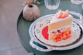 A slice of sponge cake on the plate, Strawberry shortcake with sliced strawberries on wooden table Royalty Free Stock Photo