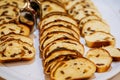 Closeup of sliced buns on tray. Buns with raisins served for breakfast on buffet line