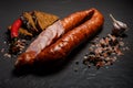 Closeup sliced dry smoked sausage with garlic, chili and rye bread Royalty Free Stock Photo