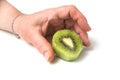 sliced kiwi fruit in shaped heart in hand of woman on white background Royalty Free Stock Photo