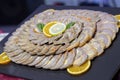 Closeup of sliced stuffed chicken roulade on a plate with orange and lemon slices Royalty Free Stock Photo