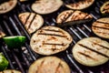 Closeup of slices of eggplant on a grill