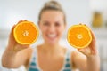 Closeup on slices of orange in hand of young woman Royalty Free Stock Photo