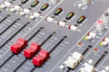 Closeup on sliders of sound mixing console in audio recording Royalty Free Stock Photo