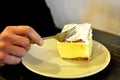 Closeup on Slovenian traditional local Gibanica -hand cutting with a fork in a restaurant in Bled