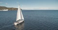 Closeup slow motion of sail boat at ocean gulf aerial. Racing yacht at sea bay. Majestic seascape Royalty Free Stock Photo