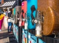 Closeup of Slush Machines with Colorful Flavors and Blurred People in the Background Royalty Free Stock Photo