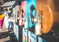 Closeup of Slush Machines with Colorful Flavors and Blurred People in the Background. Retro Style