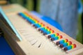 Closeup of a small clavichord with colorful keys