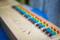 Closeup of a small clavichord with colorful keys