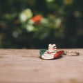 Closeup of a small Mexican hat keychain on the table with a blurry background