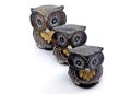 Closeup of small owl statues lined up made of wood Royalty Free Stock Photo