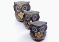 Closeup of small owl statues lined up made of wood. SINGAPORE Royalty Free Stock Photo