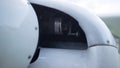 Closeup small plane engine under white aircraft hood. Part of private airplane. Royalty Free Stock Photo