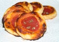 Closeup of small puff pastry pizzas with tomato sauce and oregano, food Royalty Free Stock Photo